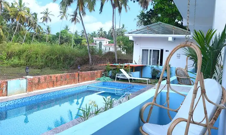 Pool View Resort near Morjim Beach – White Flower
